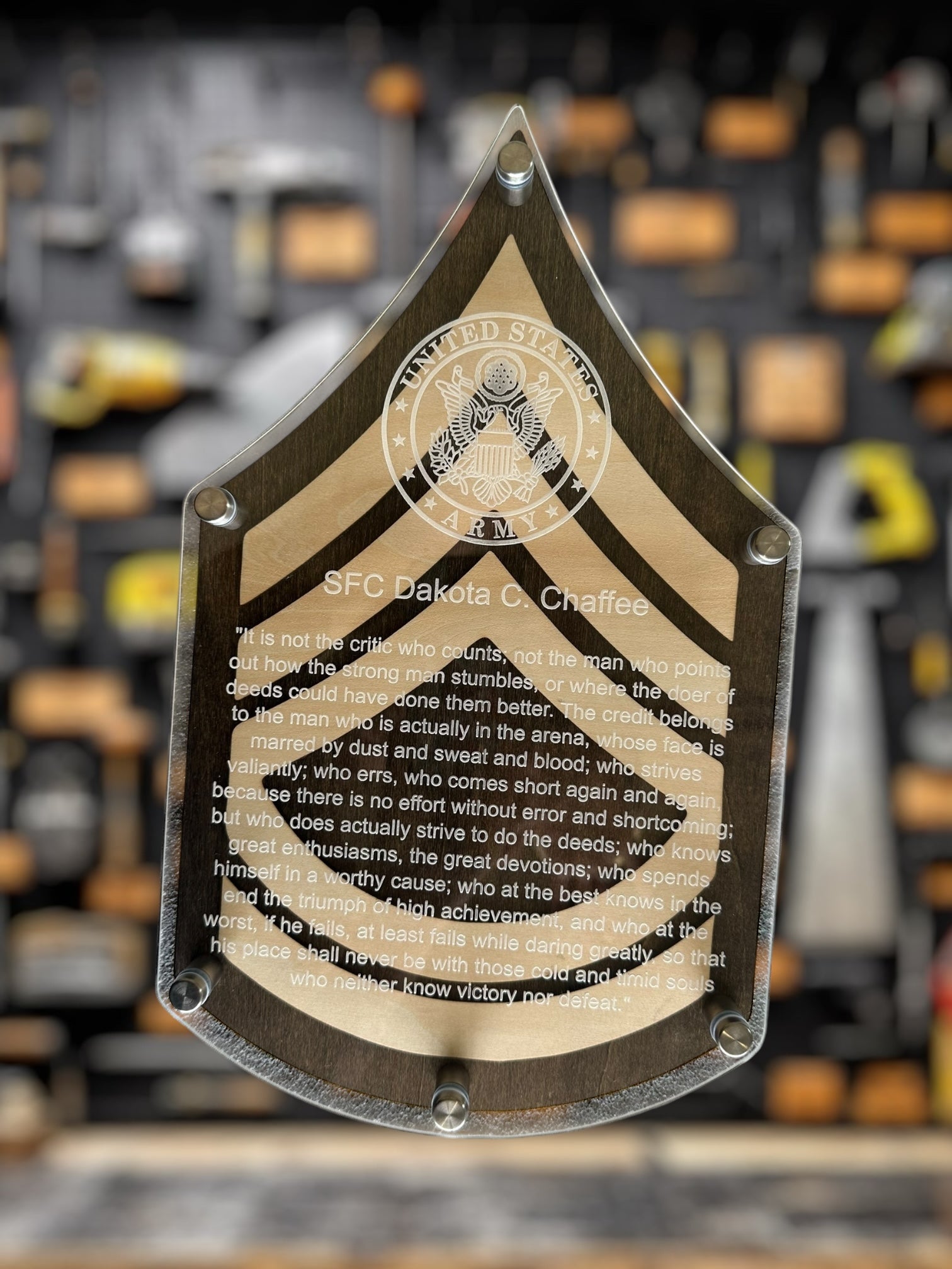 Decorative plaque with text and an army logo on a blurred background, SFC plaque for promotion