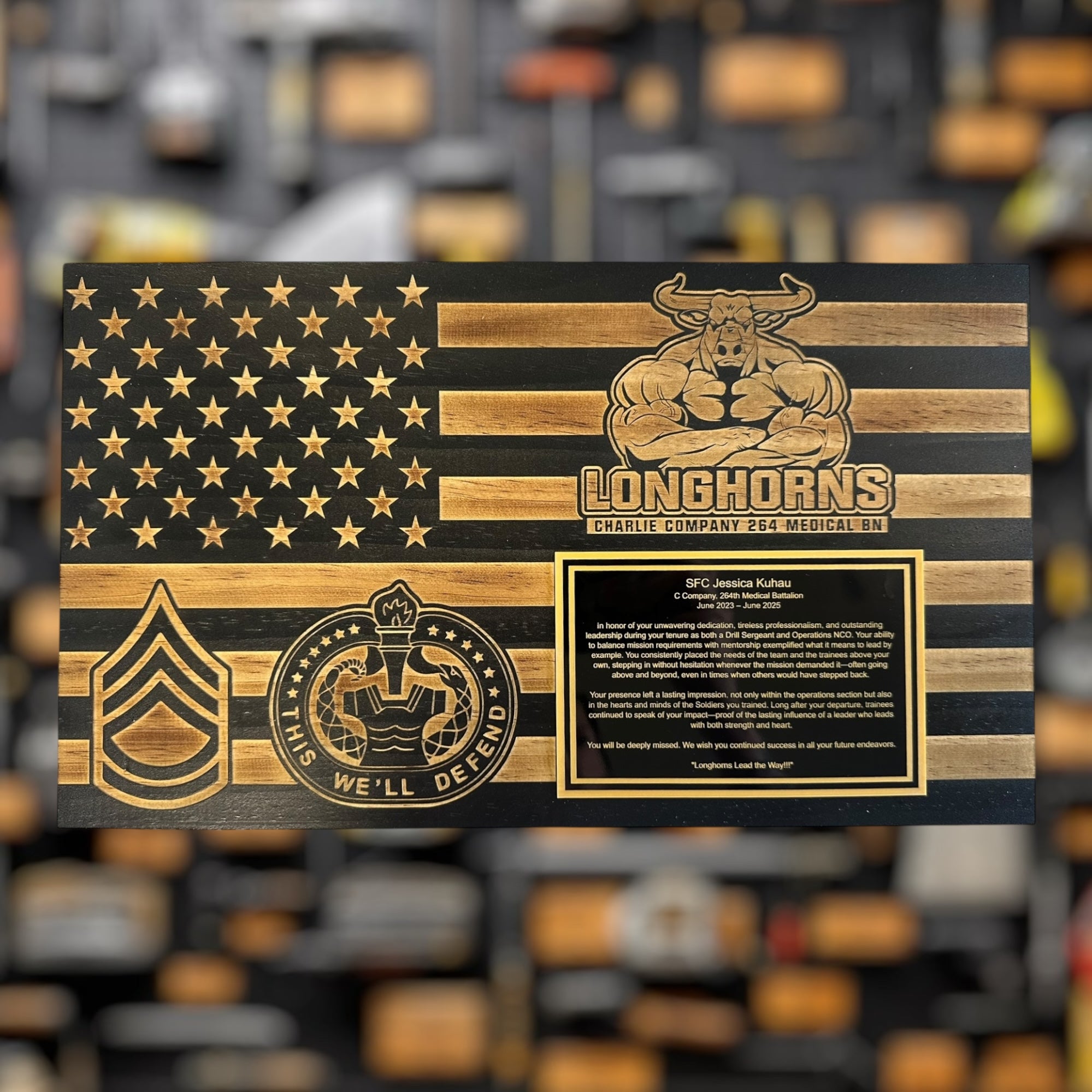 Wooden plaque military gift with American flag design and 'Longhorns' branding on a blurred background