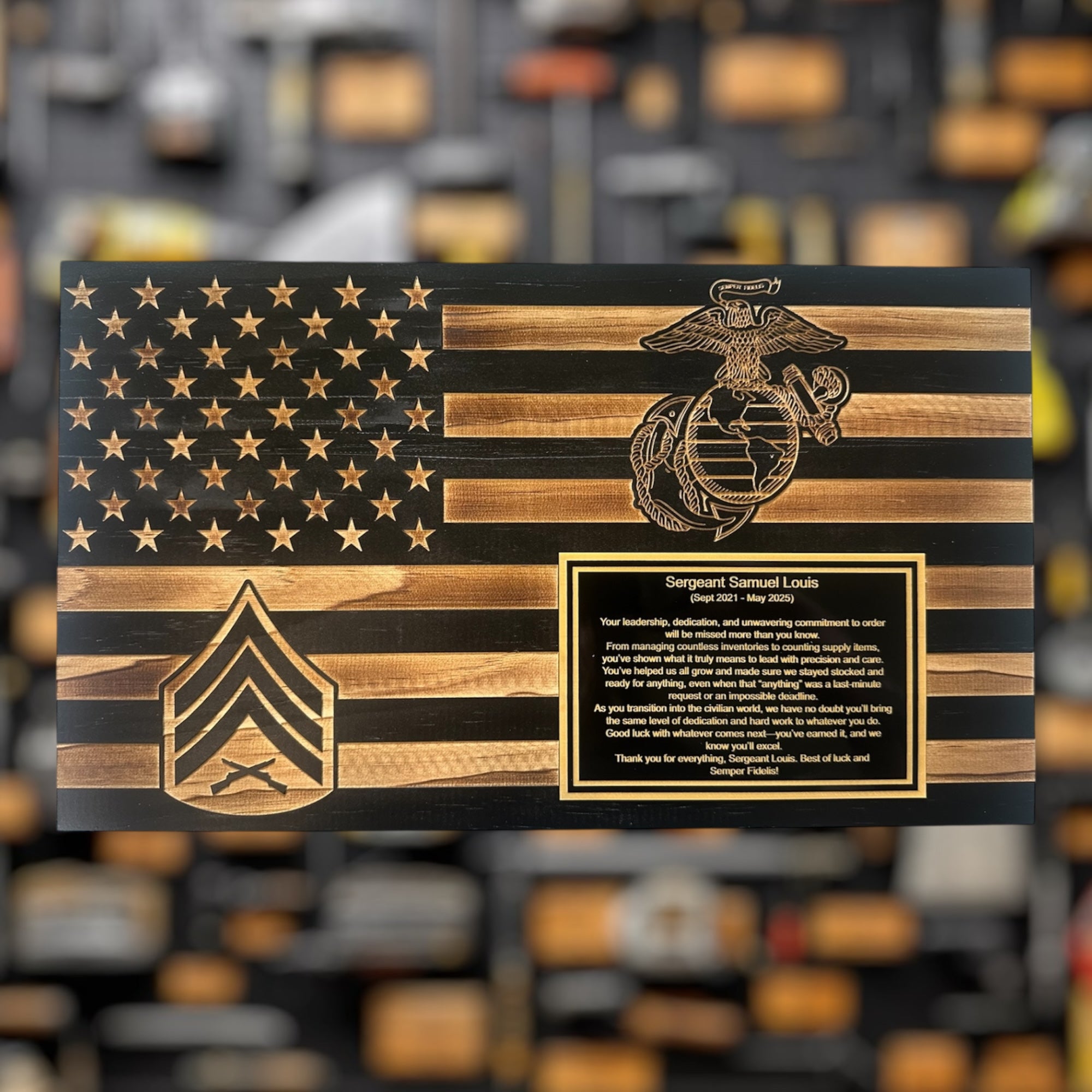 Wooden American flag military gift with military insignia, EGA, Sgt Rank and text on a blurred background