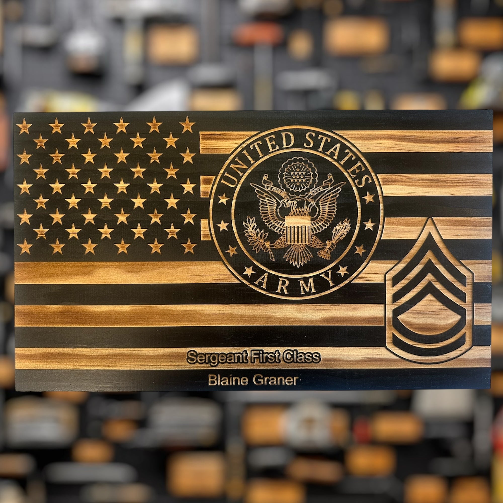Wooden plaque military gift with U.S. Army emblem and insignia on a blurred background
