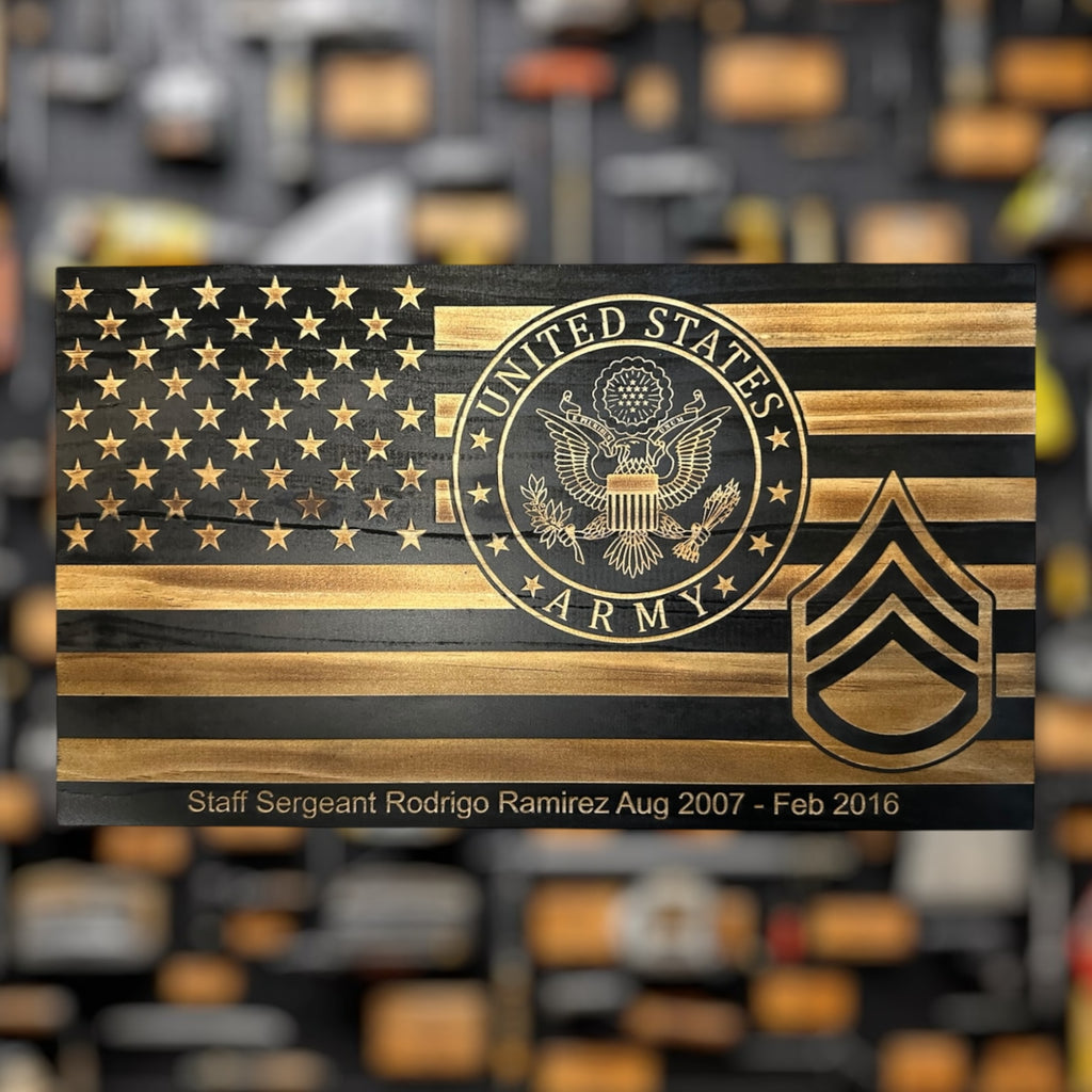 Wooden plaque military gift  with U.S. Army emblem Staff Sergeant Rank and American flag design on a blurred background